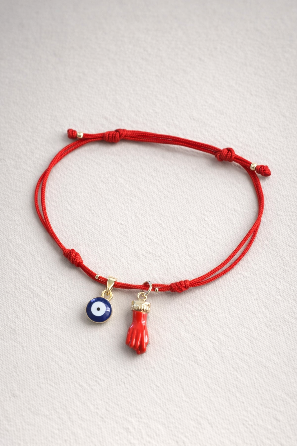 Pulsera Amuleto Protección Intensa

(ojo protector + mano roja)